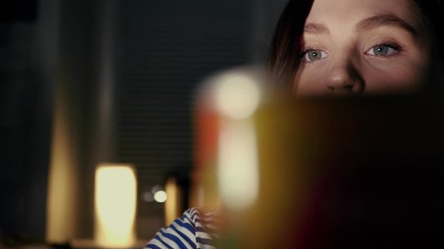 Hungry girl at night searches for food in refrigerator and finds pizza. Diet, proper nutrition, fasting, healthy lifestyle, pregnancy, gluttony concept. Slow motion and close up