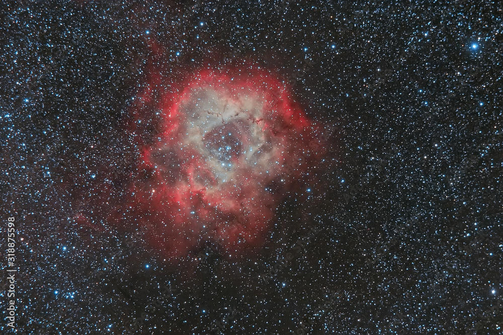 Wall mural abstract background with space image. cosmic nebulae, stars glow in space in red. photo with a long 