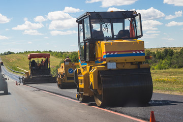 paver machine works on highway roads