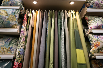 Fabric materials in a shop. Curtains at market.