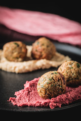 Arabic food, Falafel Humus - Delicious humus with falafel, beautifully arranged on a black plate