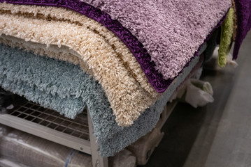 Pile of different carpets in a home decoration mall