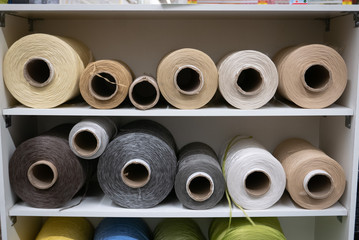 Cotton sewing threaded reels in a sewing shop