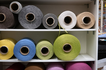 Cotton sewing threaded reels in a sewing shop