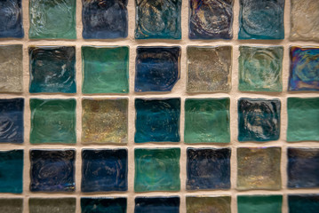 Green ceramic mosaic on the wall as background