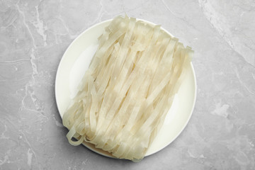 Block of rice noodles on light grey marble table, top view