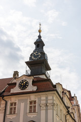 Fototapeta premium old clock tower in the street of prague