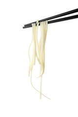 Chopsticks with tasty cooked rice noodles isolated on white