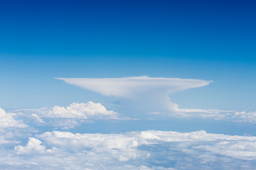 Fototapeta na wymiar Cumulonimbus incus cloud taken from the flight deck of an airliner