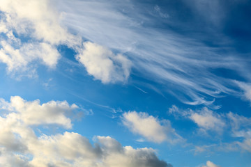 Blue sky and fluffy white clouds during the day