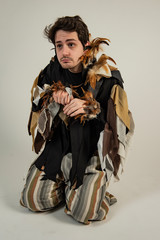 man in traditional clothes dressed for a play he is acting for the university of cumbria. 