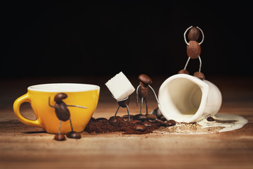 coffee bean figures with a cup of coffee and sugar cubes
