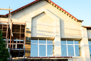 Scaffolding around a building. Renovating facade.