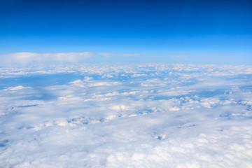 High blue sky and various shapes of white clouds