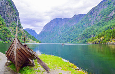 Viking boat on the coast of the Nereyfjord, Gudvangen, Norway. © jana_janina