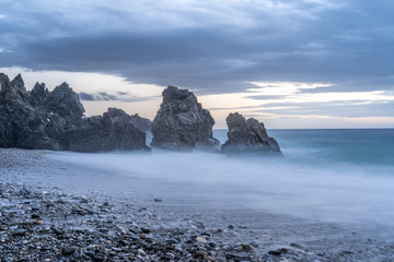 Sunset at beach of Alberquillas, Nerja, Malaga, Spain