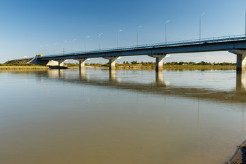Fototapeta na wymiar bridge over the Syr Darya river, Zhosaly, Kyzylorda Province, Kazakhstan.