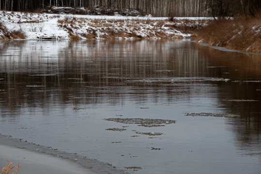 landscape of  winter river under ice