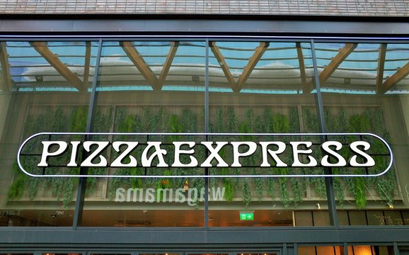 The Pizza Express sign above the entrance to their restaurant on March 20, 2018 in Bracknell, England