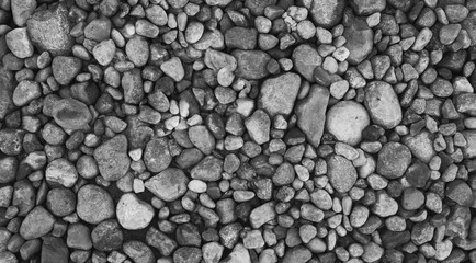 Stone nature background, outdoor rock garden. Pebbles lying on the beach.