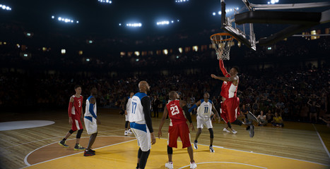 Basketball players on big professional arena during the game. Tense moment of the game.