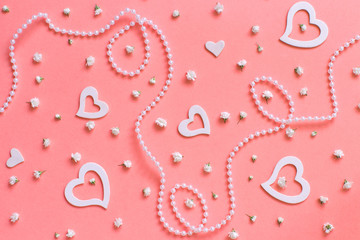 Spring composition with flowers, hearts and pearls