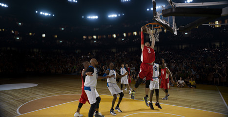 Fototapeta premium Basketball players on big professional arena during the game. Tense moment of the game.