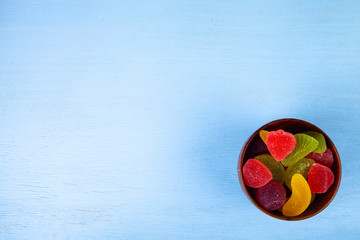 Multicolored marmalade in a bowl