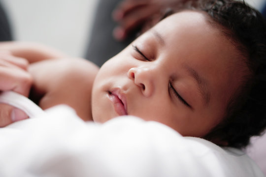 portrait of african american baby boy sleeping