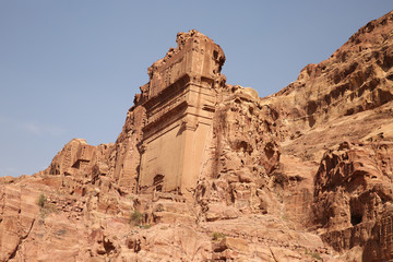 Side view of Tomb of Unayshu which has been cut into the sandstone cliff, Petra, Jordan, Middle East.