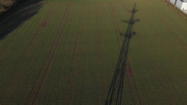 Aerial Drone View Electricity Pylons In Farmland By Rugby Cement