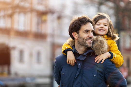 Dad and little son hugging outdoors