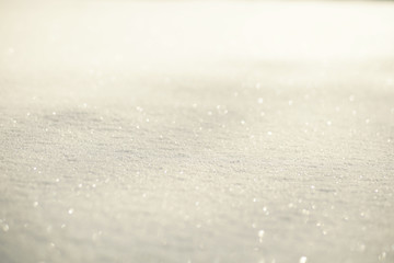 White shiny glowing snow background, snow texture on sun
