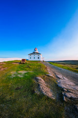 Fototapeta na wymiar Cape Spears Lighthouse, Newfoundland, Canada. This picture was shot during sunrise in summer season using fisheye lens. 