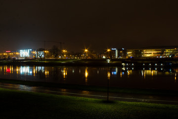 Panorama of the Polish city of Krakow, the cultural capital of Poland, with architecture glowing with bright night lights in the winter.