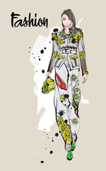 Beautiful young woman in ethnic style.. Hand drawn stylish woman portrait. Fashion lady. Festive outfit. Sketch. Fashion model posing in dress. Hand drawn fashion woman.