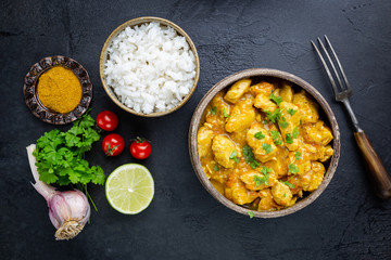 Spicy chicken cooked with curry sauce and rice, top view