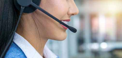 Female call center operator at work.	