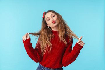 Image of amusing caucasian woman in headband making kiss lips