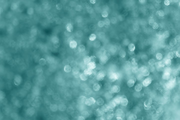 Bokeh light on blue green color background.