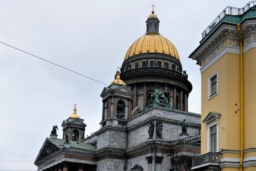 Fototapeta na wymiar St. Petersburg, Russia, January 2020. Gilded domes of St. Isaac`s Cathedral on a background of a winter sky.