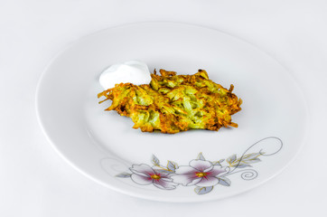 Potato pancakes with sour cream grate