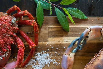 Boiled fresh crabs on the wooden kitchen board