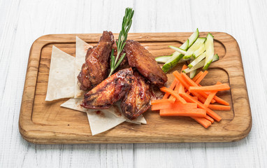 Spicy Homemade Buffalo Wings with Dip on wooden