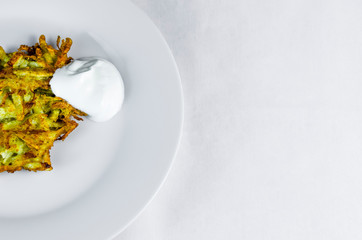 Potato pancakes with sour cream grate