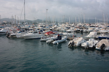 The port of Ibiza in Eivissa where boats and yachts are anchored in the VIP area of ​​the Balearic island in the blue water