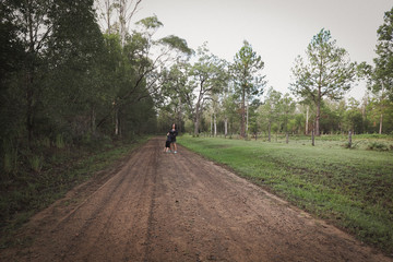 Obraz premium Mother and son playing together on country road