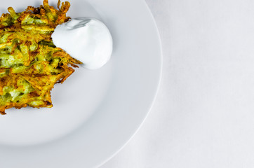 Potato pancakes with sour cream grate