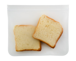Fototapeta na wymiar sliced bread in takeaway package flat lay on a white background