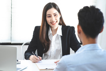 Fototapeta premium Asian real estate broker discussions with customers ,Beaming face.
